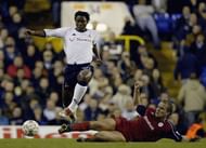 LONDON - NOVEMBER 1:  Kevin Davies of Bolton tries to tackle Mbulelo Mabizela of Tottenham Hotspur during the FA Barclaycard Premiership match between Tottenham Hotspur and Bolton Wanderers on November 1, 2003 at White Hart Lane, London. (Photo by Harry How/Getty Images)